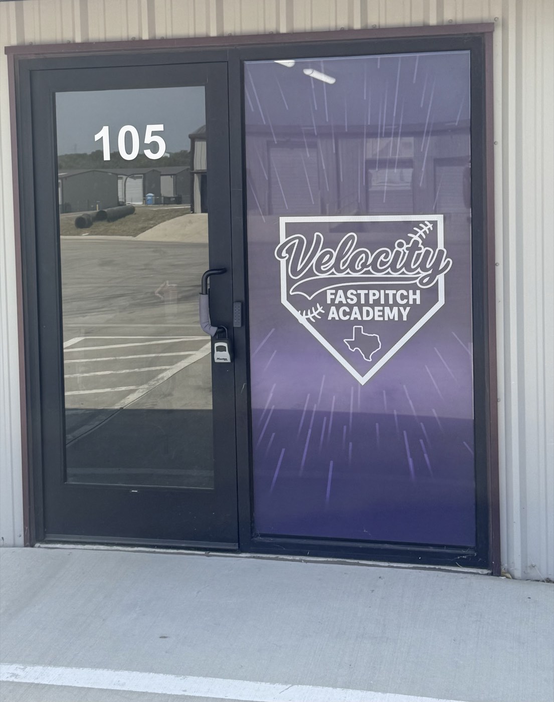 Velocity Fastpitch Academy entrance with logo, Alvarado, Texas