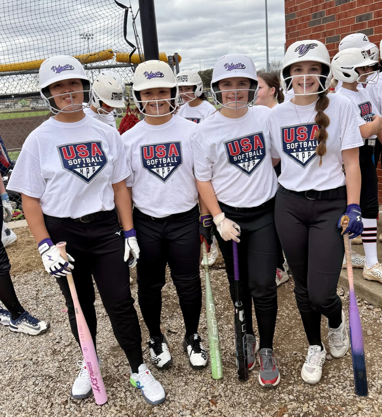 Youth softball team training at Velocity Fastpitch Academy