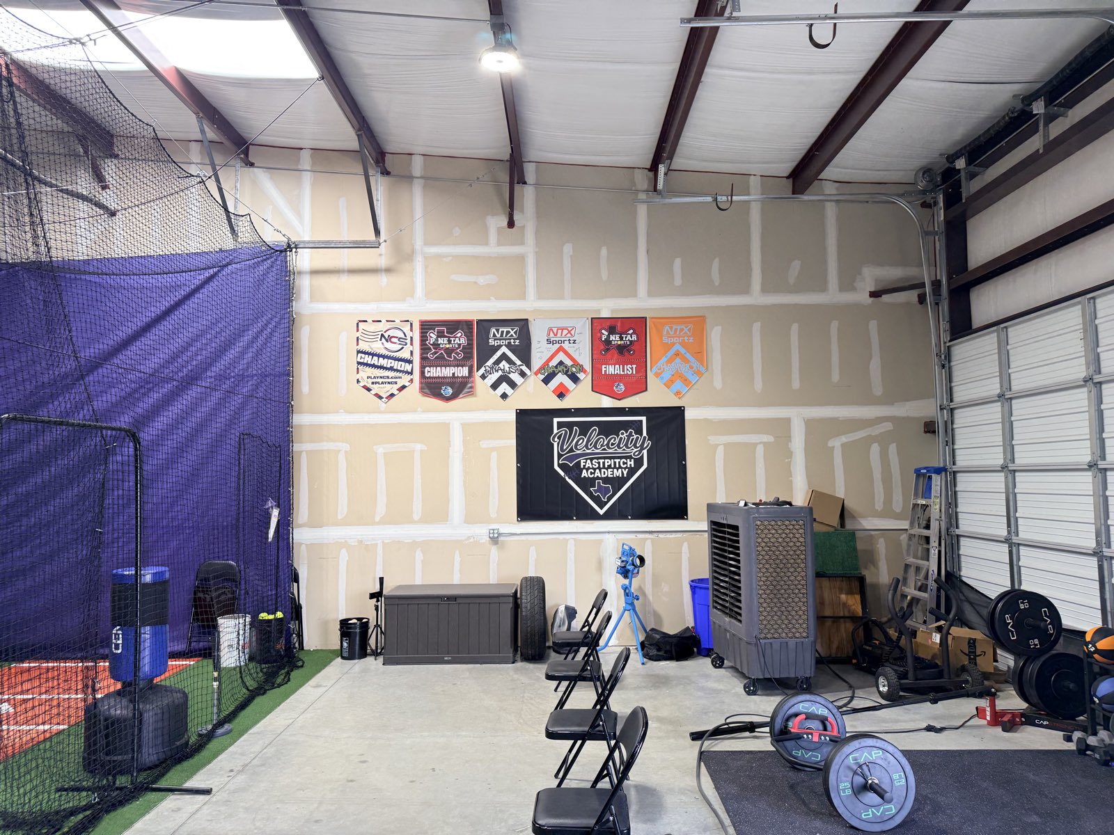 Tournament championship and finalist banners on display at Velocity Fastpitch Academy